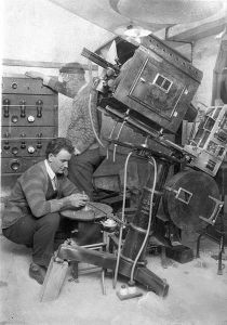 sound_technicians_setting_up_the_turn-table_and_amplifiers_for_the_first_-talkies-_in_australia_1927-1928_2877787608